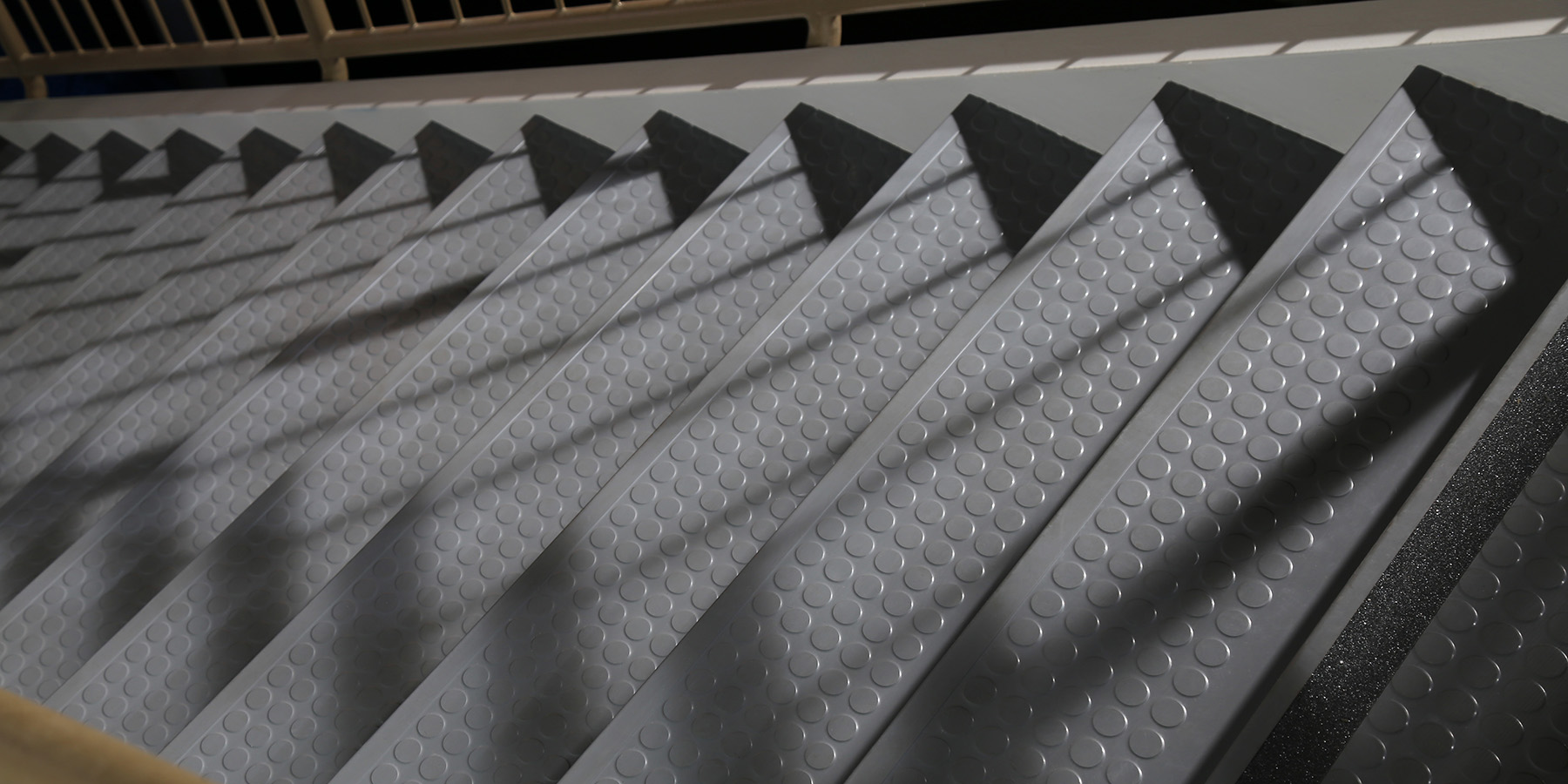 Rubber stair tread product representing a commercial stair safety solution